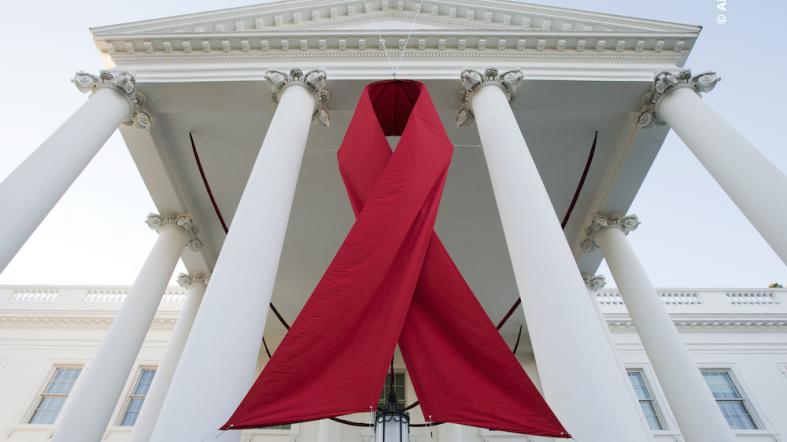 Photo of the front of the White House with a red ribbon.