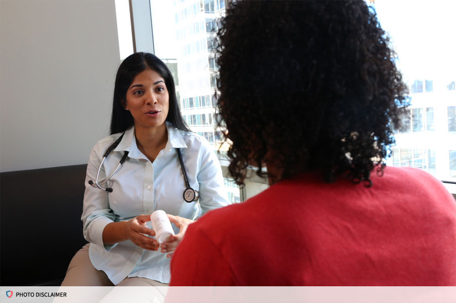 Patient and doctor talking at a desk