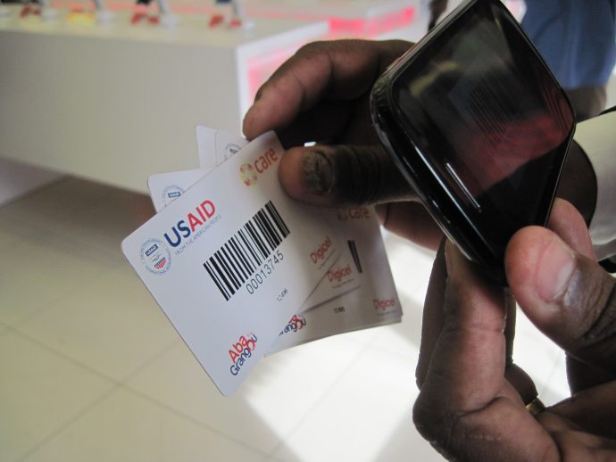 USAID blog - man hand with USAID cards - Jan 2017