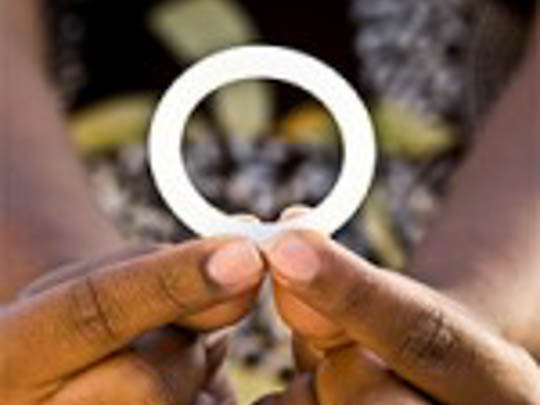 Woman holding the dapivirine vaginal ring tested in the NIH-funded ASPIRE study. Credit: International Partnership for Microbicides