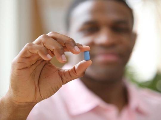 young-man-holding-prep-pill
